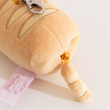 Close-up view of yellow zipper on the bottom of the keychain plush.