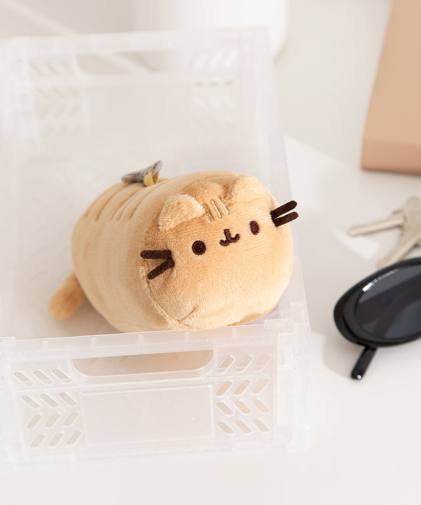 Front and side view of the yellow baguette shaped keychain plush.