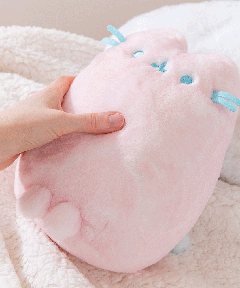 Close-up of the Pusheen Label tag that is attached near the side of the front whiskers. 