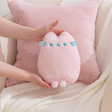 Model holding a Pink Dreamsheen Plush toy to show size and scale of plushie.