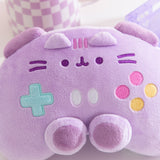 Close-up of the facial embroidery on the front of the purple plush. Pusheen the Cat's eyes, mouth, and whiskers are embroidered in dark purple while her three head stripes between her plush ears are a lighter purple. 