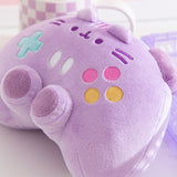 Close-up of the pink, yellow, white, and teal buttons embroidery detail on the front of the controller shaped plush.