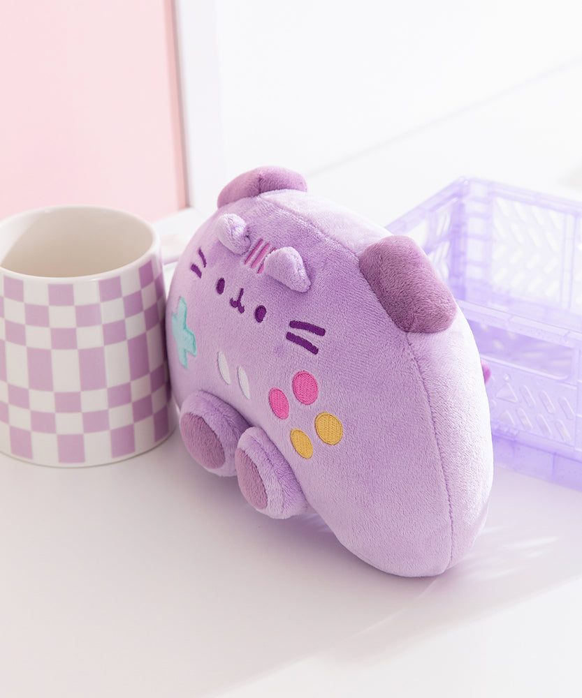 Quarter side view of the Pusheen Gamer Plush. The controller inspired plush is longer than deep to mimic a real gaming controller. 