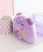 Quarter side view of the Pusheen Gamer Plush. The controller inspired plush is longer than deep to mimic a real gaming controller. 