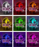 Color-changing LED night light with moon and star design with Pusheen the Cat wearing headphones.