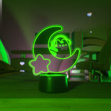 Green LED light shaped with a crescent moon, star, and Pusheen the Cat wearing headphones.