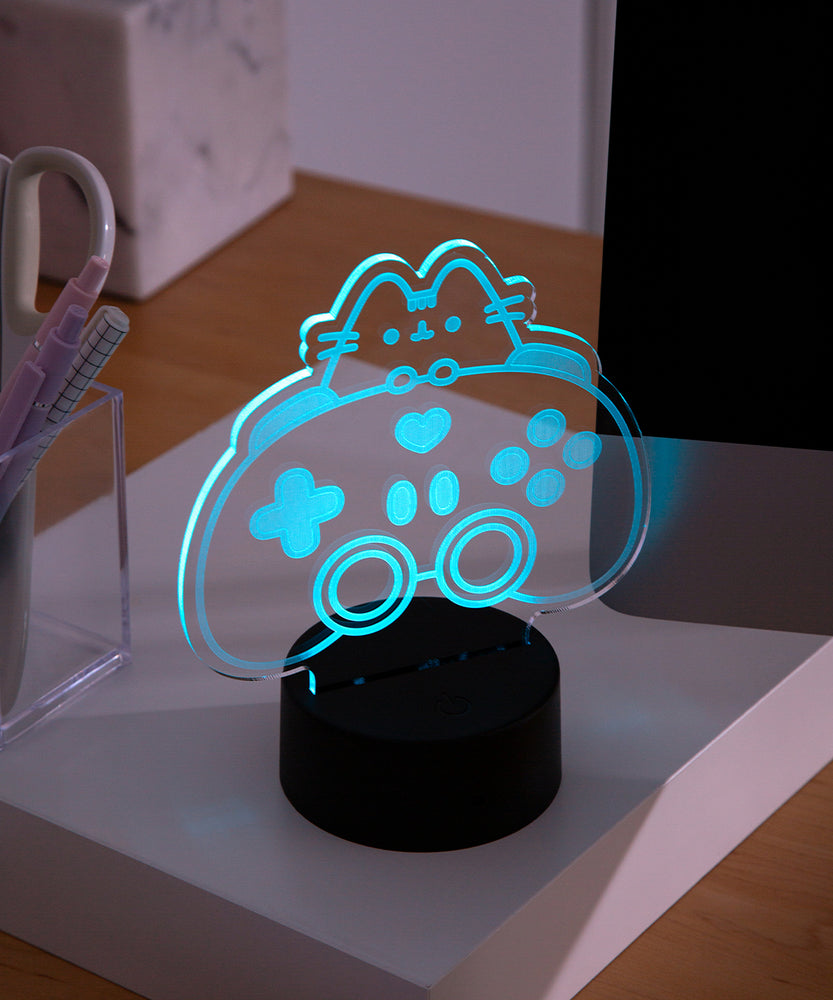 Pink LED light of Pusheen the Cat and a gaming controller.