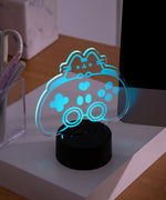 Pink LED light of Pusheen the Cat and a gaming controller.