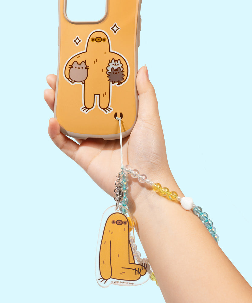 Sloth Phone Charm is attached to a Sloth Phone Case. The beaded string is inserted in the intended slot at the bottom right of the phone case.  