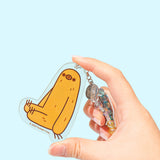 Model holds Sloth charm at the end of the beaded phone charm. Sloth is shown in yellow with dark gold hair accents with dark brown features and outline. The figure is set on a clear background.  