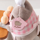 Close-up view of light pink Pusheen logo tag and embossed Pusheen Label tag. 