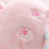 Close-up of pink toe beans paw print design.