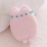Pink plush toy with blue accents on a soft beige background.