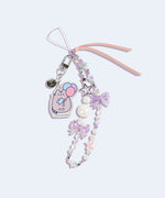 Close-up of the acrylic pastel removable charm on the Pusheen 15th Anniversary Beaded Phone Charm. The charm depicts a pastel-hued Pusheen the Cat holding blue, pink, and purple balloons. 