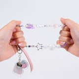 Model shows the strength of the beaded string on the cute purple phone charm. 