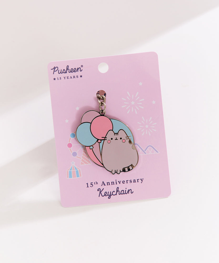 Carnival themed Pusheen keychain is attached to a unique light purple backer card that says "Pusheen 15 Years" and "15th Anniversary Keychain."