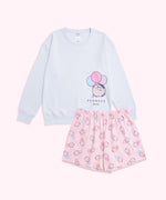 Pusheen 15th Anniversary Pajama Set lies as a set on a background. The oversized light blue sweatshirt has a graphic of Pusheen the Cat with balloons on the wearer's left. The stretchy patterned shorts have an all over pattern of Pusheen holding pastel balloons. 