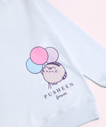 A close-up view of the graphic print on the 15th Anniversary Sweatshirt. The graphic shows Pusheen blushing next to blue, pink, and light purple balloons and the phrase "Pusheen forever" underneath. 