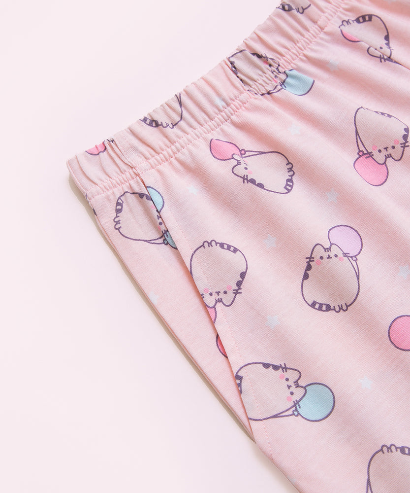 A close-up view of the elastic band on the Pusheen pajama shorts and one of the side pockets on the side of the shorts. 