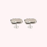 Pair of silver Pusheen stud earrings angled to show the silver earring posts and backers.