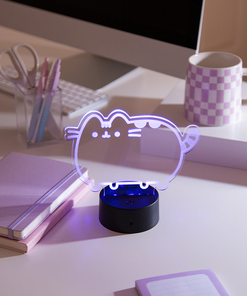 Close-up of the acrylic plate on the Pusheen Otaku Lamp. The lamp is set to the color pink purple.