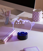 Close-up of the acrylic plate on the Pusheen Otaku Lamp. The lamp is set to the color pink purple.
