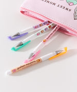 Pusheen Pen Set coming out of the Sweets Pencil Case. The phrase printed among the macaron graphics on the pen barrels says "pusheen macarons" and "sweet every day."