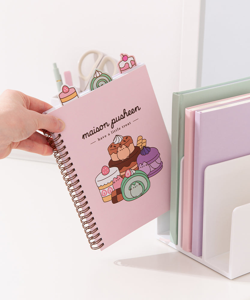 Model places the Pusheen Sweets project notebook in a file divider to show size of the the pink sweets notebook.