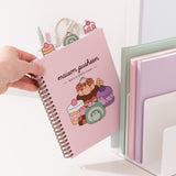 Model places the Pusheen Sweets project notebook in a file divider to show size of the the pink sweets notebook.