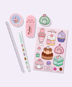 Close-up view of the contents of the Pusheen Sweets Stationery set. The pencil, pen, stickers, eraser, pencil sharpener, and highlighter include graphics and prints of Pusheen the Cat as various sweet dessert characters and flavors including a strawberry, lavender, chocolate, matcha, vanilla, and cherry.