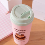 Top view of the lid on the Pusheen Sweets Travel Mug. The mint green lid has a sipping hole and sliding closure for ventilation. 