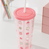 Close-up view of the pink screw top lid on the Pusheen Sweets Tumbler. Coming out of the top is a white plastic straw. 