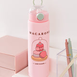 Front view of the Pusheen Sweets Water Bottle. The pink bottle features a clear pop-top lid activated by a mint green button, a mint green carrying ring, and a light pink base.