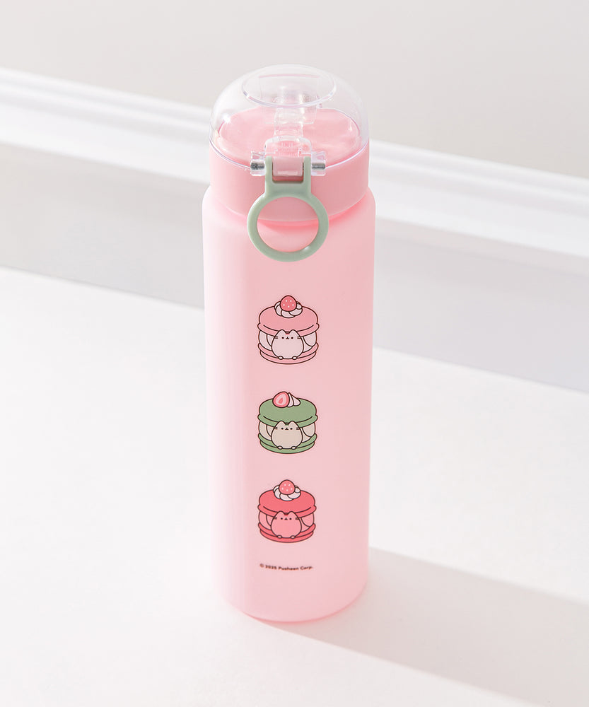 Pink pusheen water bottle is a vertical graphic down the center back of the Sweets Water Bottle. Pusheen transforms into light pink, white, green, and medium pink macarons. 