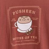 Close-up view of the tea graphic tee. The phrases surrounded Pusheen the Cat in a yellow font are "Pusheen," "100% real cute," "enjoy each moment," "House of Tea," and "a cup of tranquility."