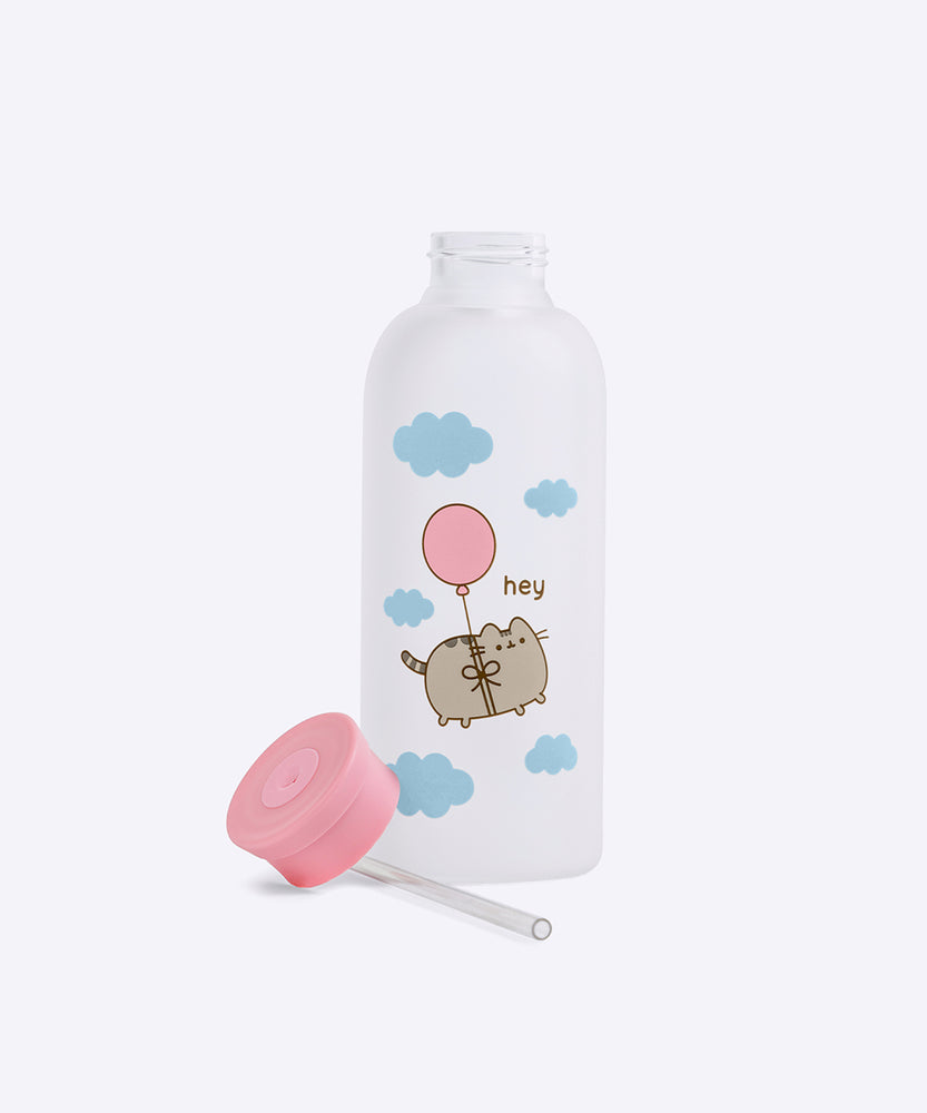 Aerial view of the clear silicone bottle opening. Printed on the Pusheen water bottle is Pusheen the Cat tied to a pink balloon while floating through blue fluffy clouds.