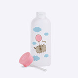 Glass water bottle stands on a white surface with the included pink top lid and plastic straw lying next to the bottle. 