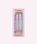 Pusheen Deluxe Gel 3-Pen Set in its packaging box. The pink and purple box includes the Pusheen logo and a graphic of the cat's face at the bottom above the product title "3 Deluxe Gel Pens."