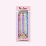 Pusheen Deluxe Gel 3-Pen Set in its packaging box. The pink and purple box includes the Pusheen logo and a graphic of the cat's face at the bottom above the product title "3 Deluxe Gel Pens."