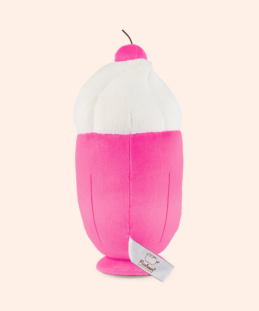 Back view of the Pusheen Fruits Fruit Parfait Plush. The bottom two-thirds of the plush is a hot pink color that tapers to a smaller base while the top portion of the plush of is a swirl of a fuzzy whipped plush topping. 