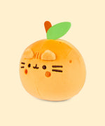 Left quarter view of the orange-colored Pusheen Squisheen. In this angle, the dark orange embroidered spots doting around the top of the small plush can be seen. 