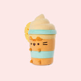 Left quarter view of the Pineapple Float Plush. The drink-inspired plush has a fuzzy whipped topping in a swirl pattern.