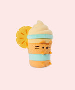 Right quarter view of the medium sized plush. The felt orange slice sits off the middle and top portion of the plush. Pusheen's ears and four paws extend off the body of the drink container portion of the plush.