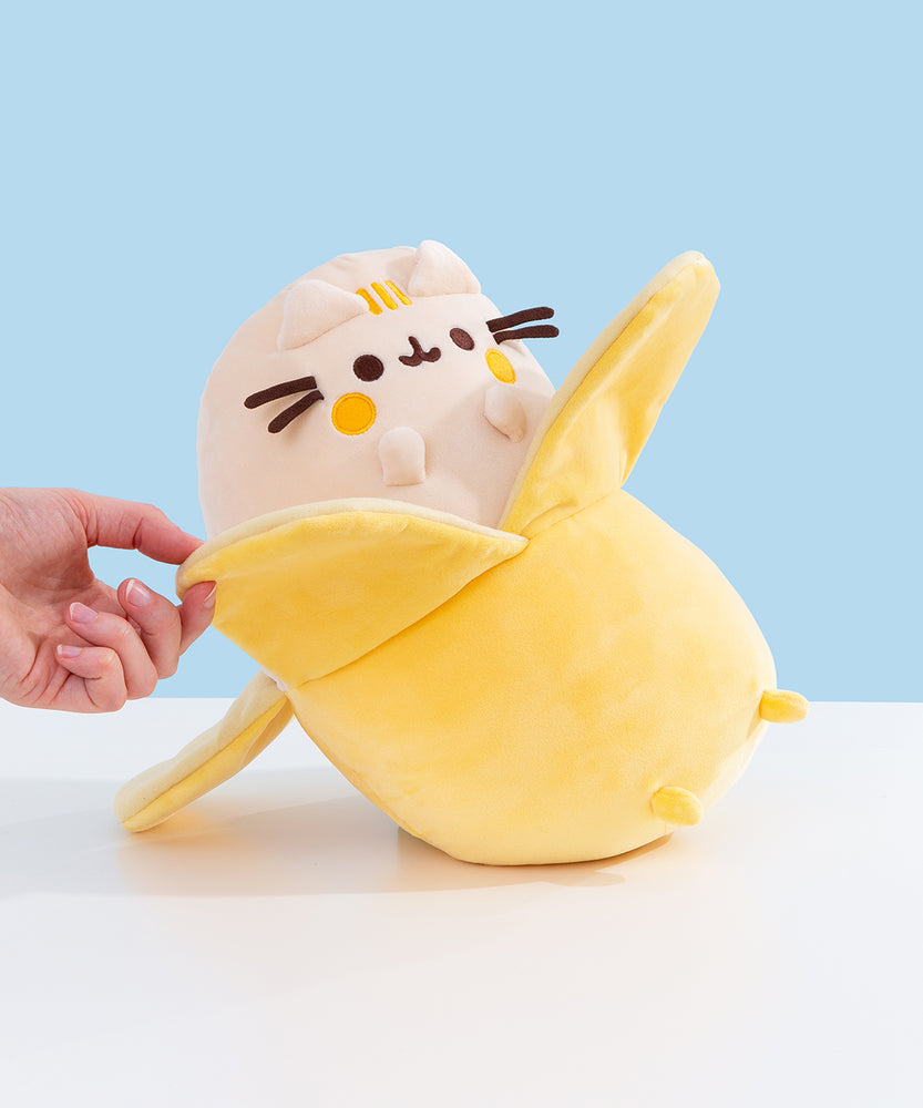 Model holds one part of the slightly darker yellow banana peel to show size.