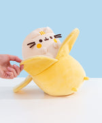 Model holds one part of the slightly darker yellow banana peel to show size.