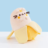 Quarter side view of the Scented Banana Squisheen. The plush sits upright via plastic pellets.