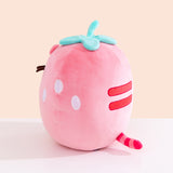 Side and back view of the Pusheen Fruits Scented Strawberry Squisheen Plush. On one side is three white circles to mimic strawberry seeds.