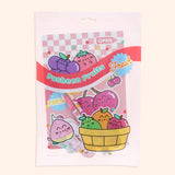 Front view of the enclosed Pusheen Fruits Stationery Set. The items in the set are encased in a clear and pink plastic resealable pouch with a graphic of Pusheen the Cat as various colorful Fruits including grapes, strawberry, peach, cherry, pear, orange, and apple.