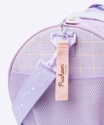 Close-up of the pink zipper pull on the Pusheen travel bag. The zipper pull has the Pusheen the Cat text logo while the removable shoulder strap has the cat logo repeatedly printed down the strap. 