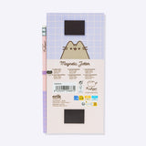 Back view of the Pusheen Magnetic Shopping List Notepad. The pink and purple cardboard backer card has two magnetic strips to ensure a strong hold. One magnet is near the top of the rectangular notepad while one magnet is near the bottom. 